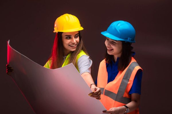 female-construction-engineers-working-together-discussing-project-plan (1)